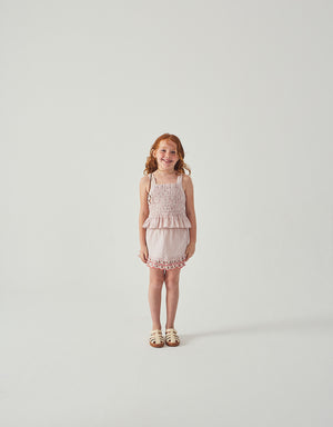 Flatlay front view of the Remi Ruffled Hem Skorts with Botanical Embroidery, showcasing layered hem and seersucker texture from the Spring Summer collection of Filipino kids fashion brand Gingersnaps Philippines.