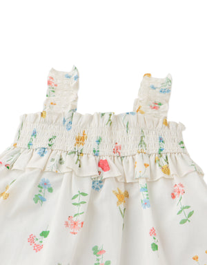 Close-up front detail of the Baby Jennie Smocked Cotton Top, highlighting smocked fabric, white cotton material, and floral print from the Spring Summer collection of Gingersnaps Philippines.