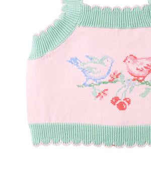 Flatlay front view of the Baby Rosé Combed Cotton Knit Top with Cross-Stitch Embroidery, showcasing pink cotton knit fabric and embroidered bird details from the Spring Summer collection of Filipino kids fashion brand Gingersnaps Philippines.