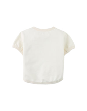 Flatlay back with details of the Baby Chalice Cotton Barrel Tee in off-white showcasing the smooth cotton material, c