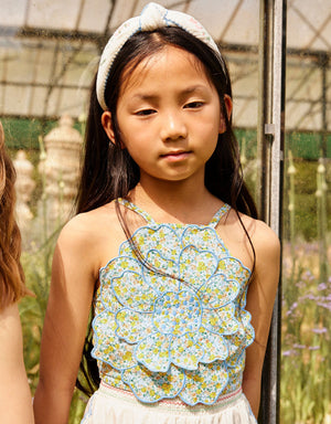 Campaign photo of the Eloise Halter Top in Multicolor with Large Flower Appliqué & Contrast Stitching for kids from the Spring Summer collection of Filipino kids fashion brand Gingersnaps Philippines, featuring a bold floral appliqué and halter silhouette.