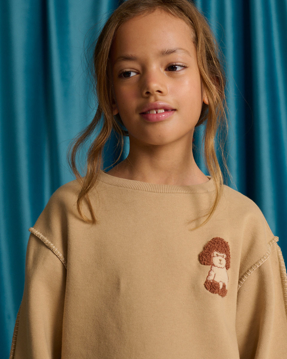 Faustina Sweater with Contrast Hand Blanket Stitching and Poodle Cheerful Appliqué
