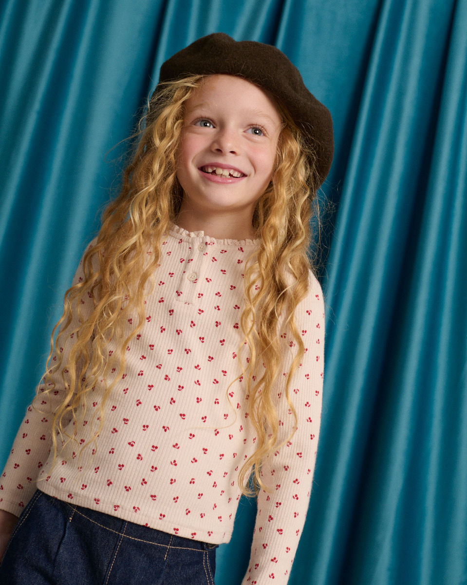 Apolinaria Pointelle Ribbed Tee in All-Over Cherry Print with Button Placket and Ruffled Neckline
