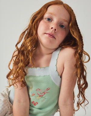 Flatlay front view of the Gabriella Top with Cross-Stitch Embroidery & Scalloped Edges, showcasing knit texture and embroidery placement from the Spring Summer collection of Filipino kids fashion brand Gingersnaps Philippines.