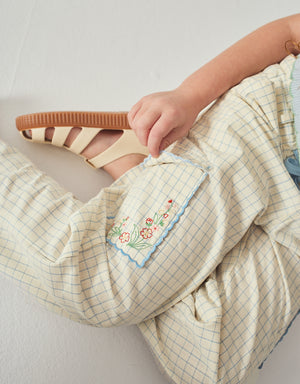 Campaign photo of the Ariana Cargo Pants with Embroidered Pockets & Paper-bag Waist for kids from the Spring Summer collection of Filipino kids fashion brand Gingersnaps Philippines, featuring embroidered pockets and a paper-bag waist.