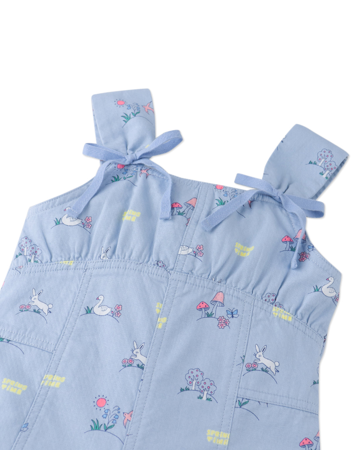 Close-up front detail of the Harvey Empire-Cut Playsuit, highlighting bow ties and printed motifs from the Spring Summer collection of Gingersnaps Philippines.